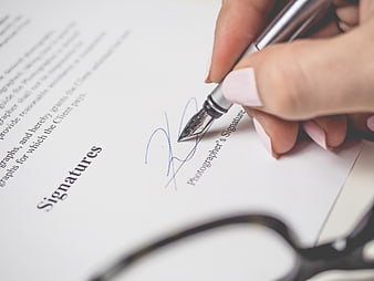 Hand Signing Contract with Fountain Pen Close Up
