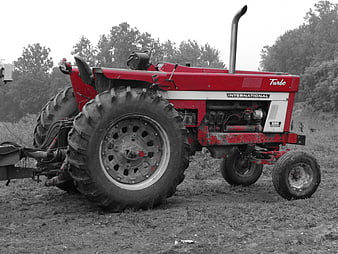 Vintage red International 1066 Turbo tractor in a field