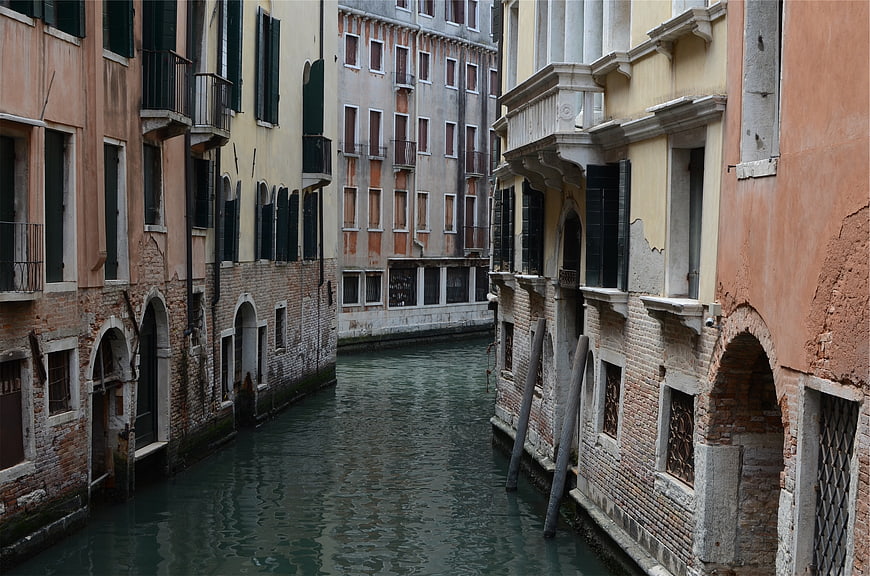 Narrow Venice Canal with Historic Buildings and Water