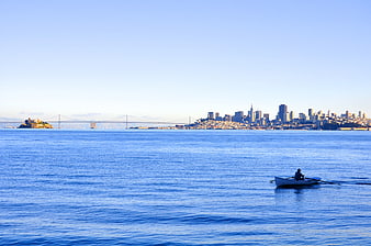 Rowing boat in San Francisco Bay with skyline and Alcatraz