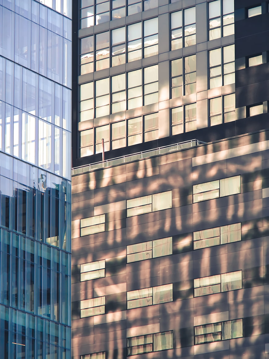 Modern Glass Office Building Facade with Shadows