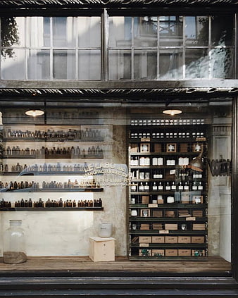 Vintage Perfume Shop Window Display with Glass Bottles