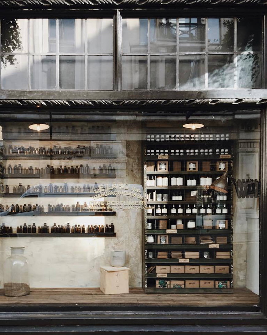 Vintage Perfume Shop Window Display with Glass Bottles