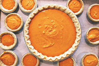 Top View of Unbaked Pumpkin Pie and Mini Pies