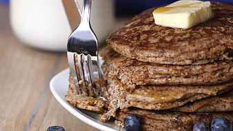 Stack of Whole Wheat Pancakes with Butter and Blueberries