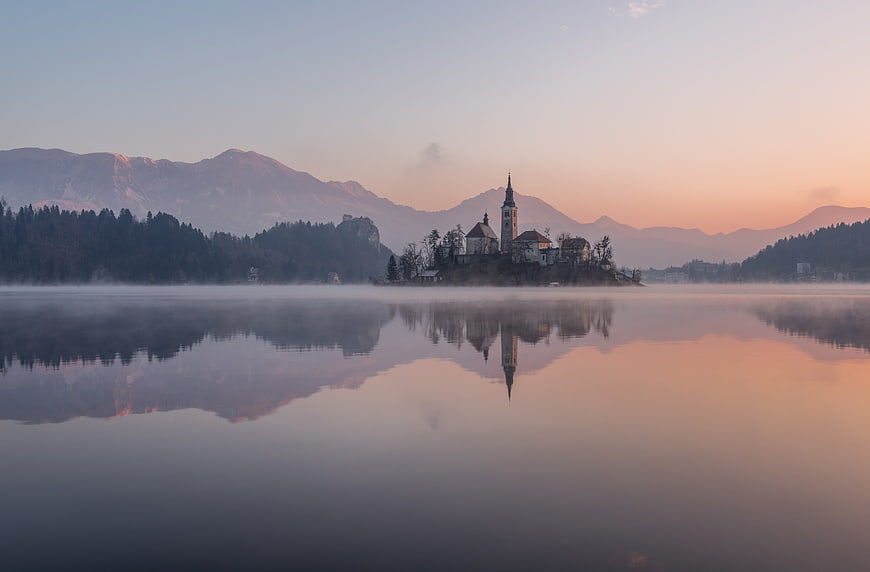 Serene Lake Bled Church Reflection at Sunrise