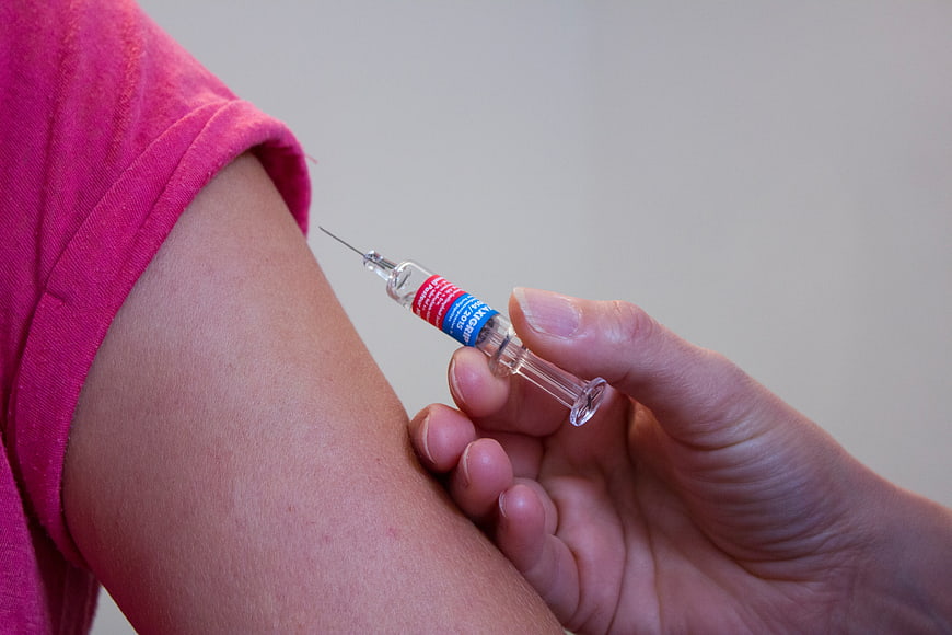 Close-up of vaccination injection in upper arm