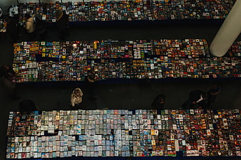 Overhead view of crowded media market with CDs and DVDs