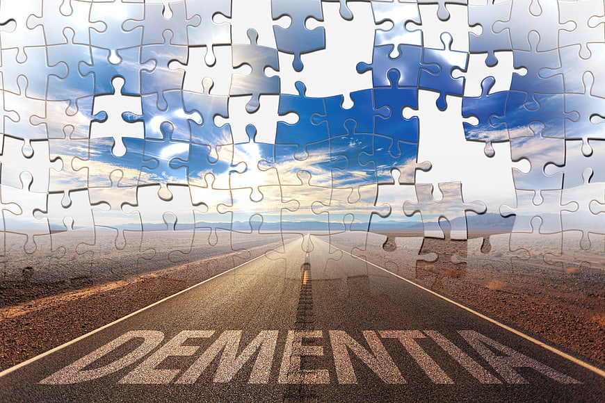 Dementia Concept: Road With Missing Puzzle Pieces In Sky