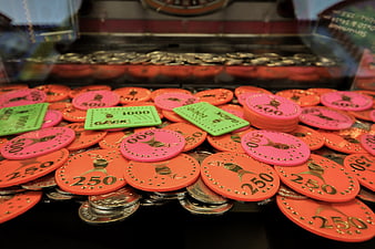 Colorful Arcade Game Tokens and Coins in Prize Machine