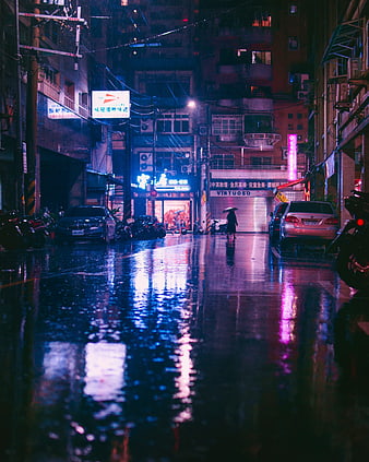 Cinematic Night Street Scene in Asia with Rain Reflections and Neon Lights