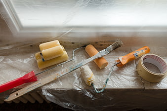 Painting Tools And Supplies On Plastic Drop Cloth