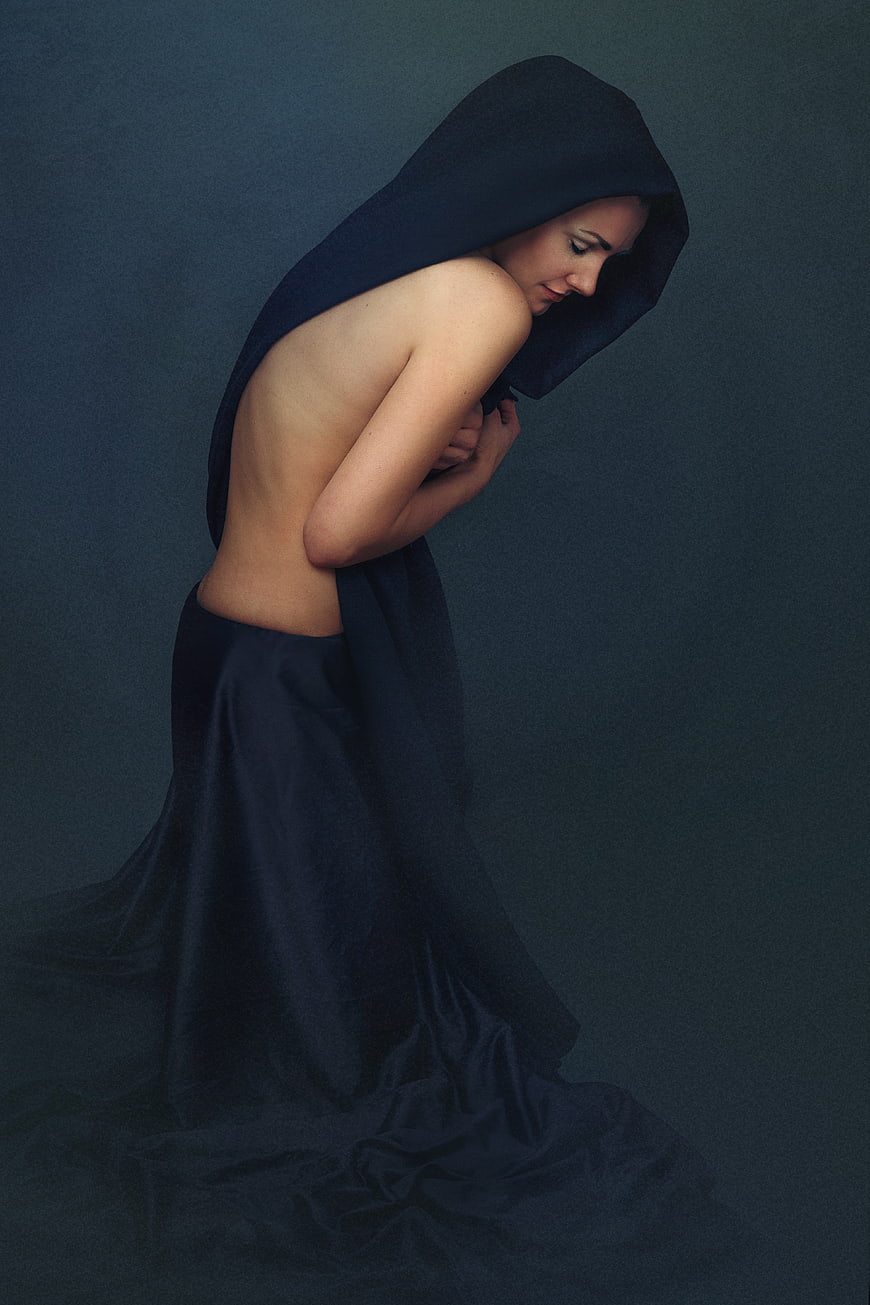 Artistic Portrait of Woman in Dark Draped Fabric