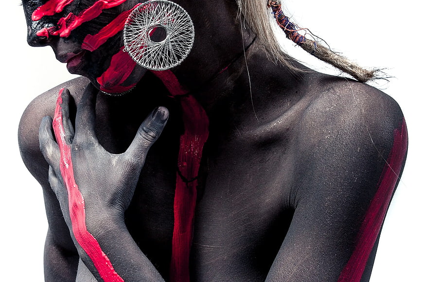 Artistic Portrait of Woman with Black and Red Body Paint