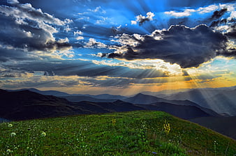 Dramatic Sun Rays Over Mountain Meadow Landscape