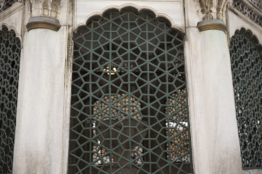 Traditional Islamic Architecture with Intricate Geometric Lattice Screen