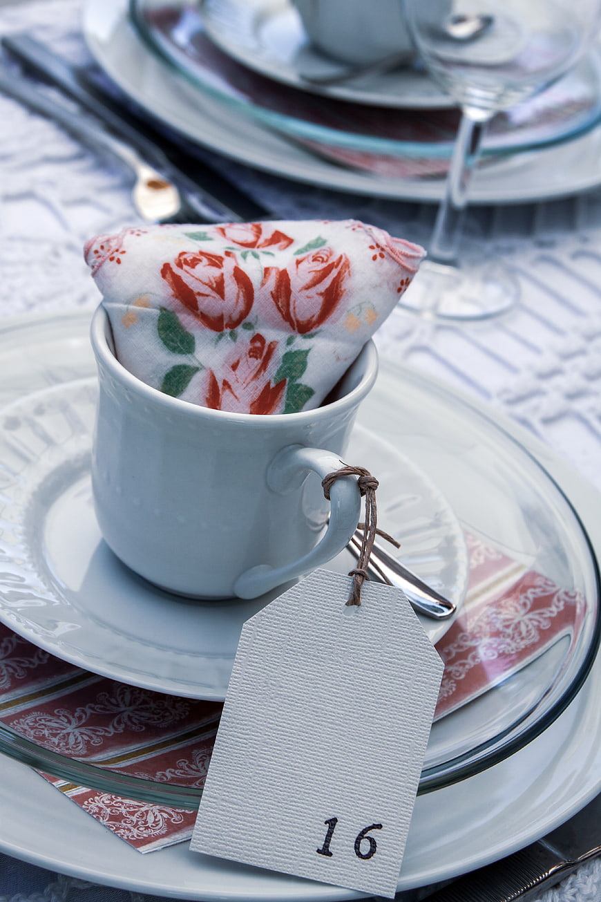 Elegant table setting with floral napkin and place card
