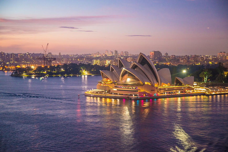 Sydney Opera House at Dusk with City Skyline Reflection