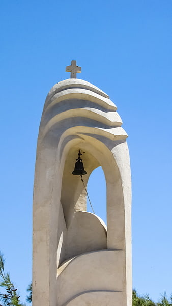 White Church Bell Tower Against Blue Sky
