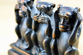 Three Wise Monkeys Wooden Figurines Close-Up