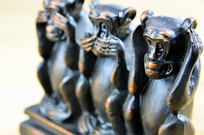 Three Wise Monkeys Wooden Figurines Close-Up