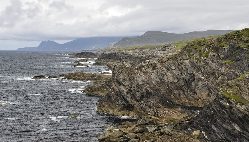 Rugged Irish Coastline with Rocky Cliffs and Ocean Waves