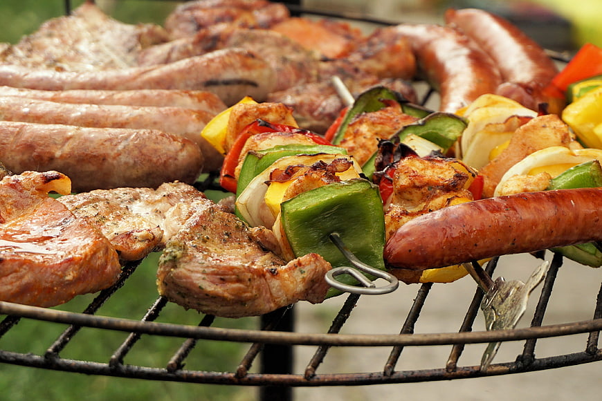 Assorted Grilled Meats and Vegetable Skewers on Outdoor Barbecue Grill
