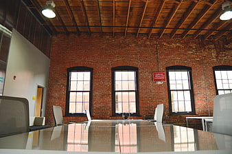 Modern Loft Office with Exposed Brick and Wooden Beams