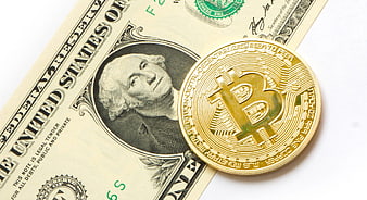 Physical Bitcoin Coin on US Dollar Bill