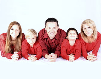 Happy family of five lying on white background in red clothes