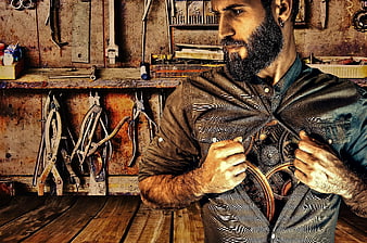 Bearded man revealing steampunk gears inside chest in workshop