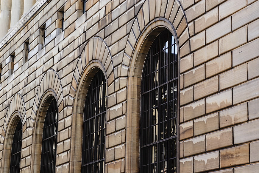 Arched stone windows on a historic building facade