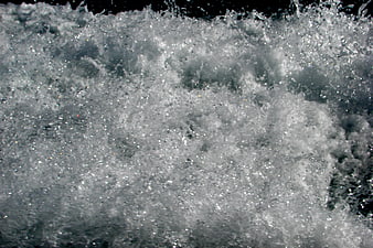 Close-up texture of splashing white water foam and bubbles