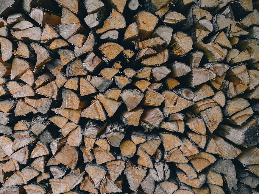 Close-up texture of stacked firewood logs