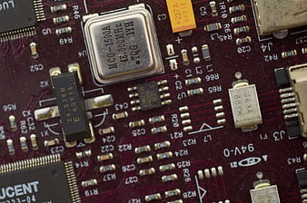 Macro shot of red electronic circuit board components