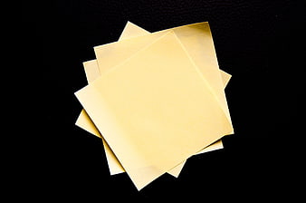 Stack of Yellow Sticky Notes on Black Background