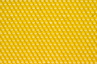 Close-up texture of yellow honeycomb pattern