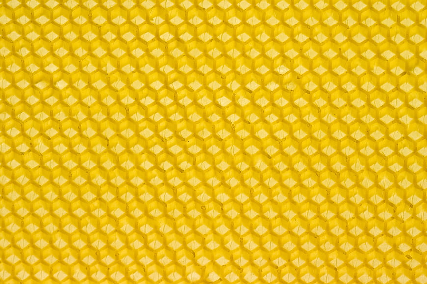 Close-up texture of yellow honeycomb pattern
