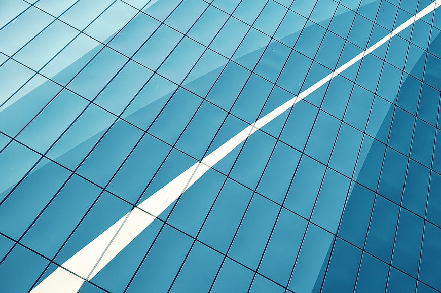 Abstract Blue Glass Building Facade with Diagonal White Reflection