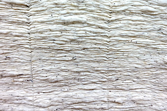 Close-up of textured white layered material with wavy pattern