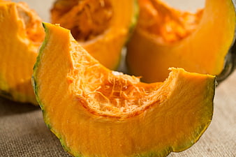 Fresh Sliced Pumpkin on Rustic Burlap Background