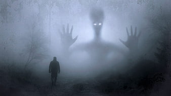 Scary ghost monster in foggy forest with glowing eyes