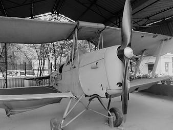 Vintage Biplane Aircraft in Hangar Black and White