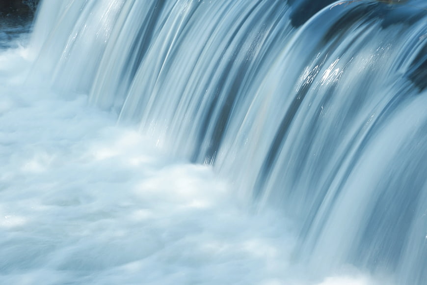 Long Exposure Waterfall Flowing Over Rocks