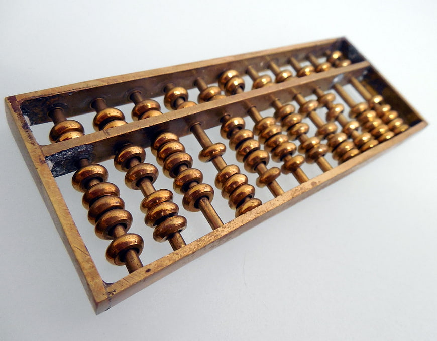 Vintage Brass Abacus on White Background