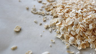 Rolled Oats on White Surface with Copyspace