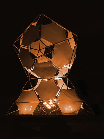 Illuminated Geometric Sculpture with Warm Candlelight