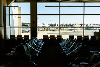 Empty Airport Terminal Waiting Area with View of Tarmac