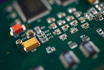Macro Close-Up of Green Electronic Circuit Board Components