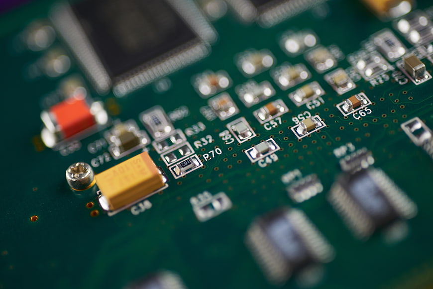 Macro Close-Up of Green Electronic Circuit Board Components
